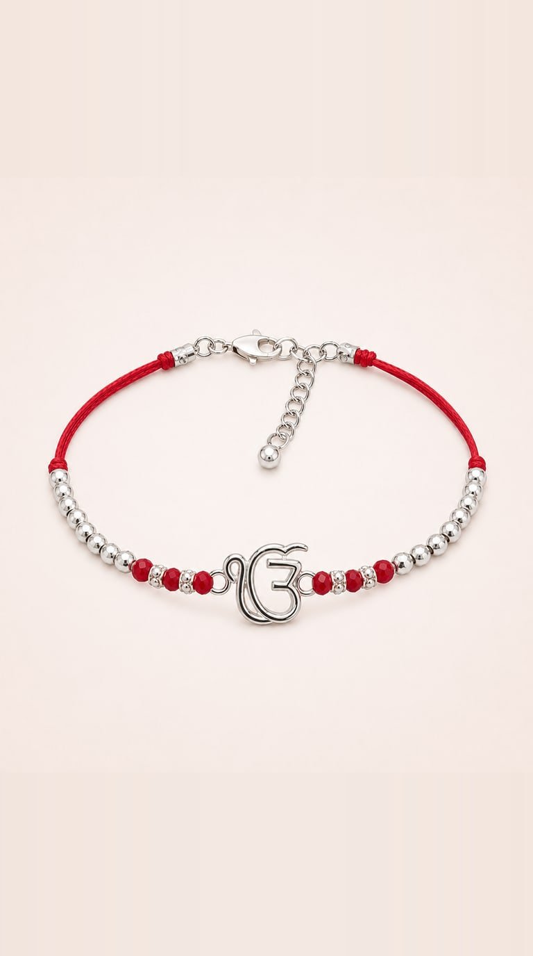 Silver Ek Onkar rakhi on a red thread with silver and red beads and a lobster clasp