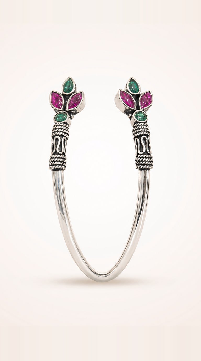 Open oxidised silver cuff kada with marquise ruby and emerald stones at both ends