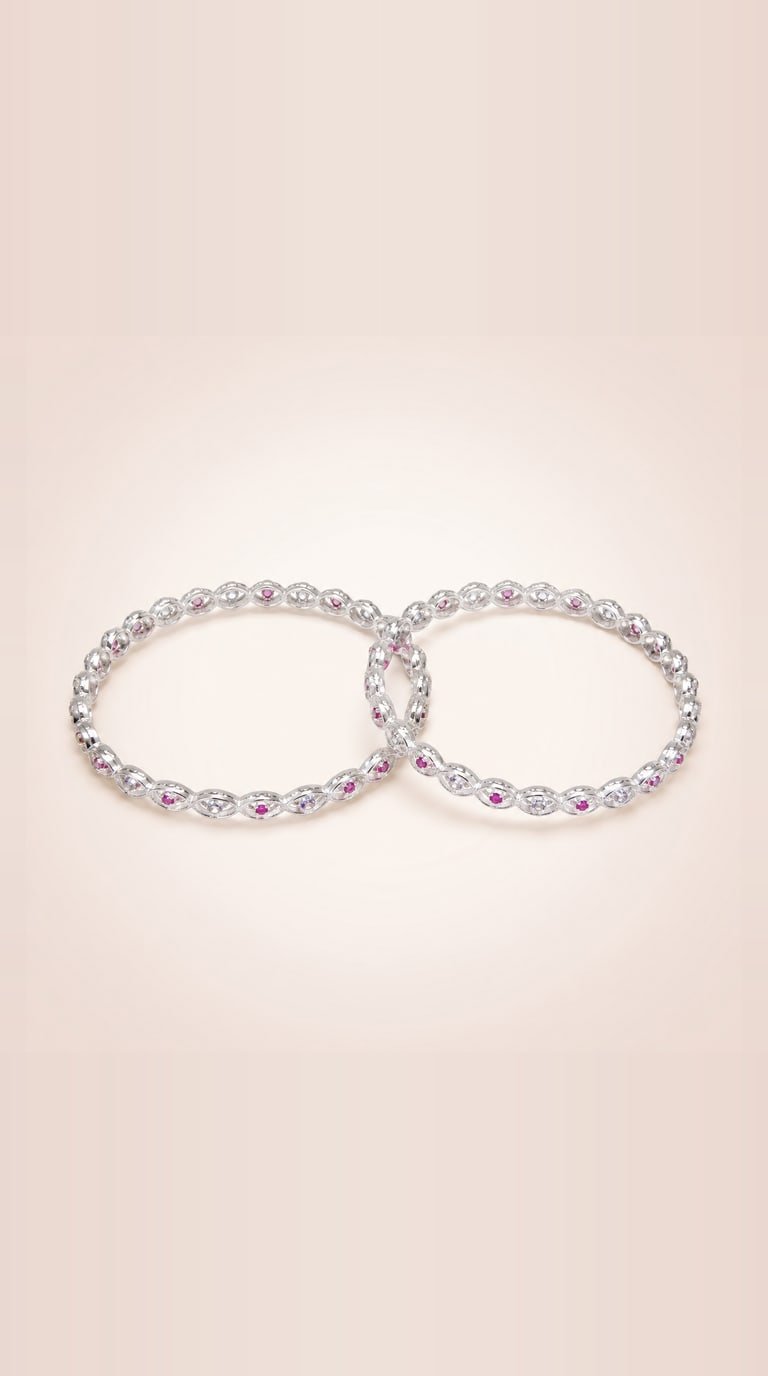 Pair of sterling silver marquise-link bangles set with ruby and white stones, interlocked