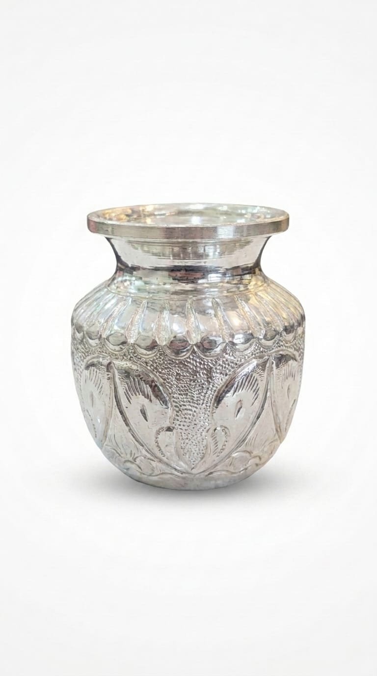 Engraved silver kalash pot on a white background